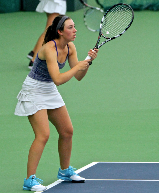 Bridget Noack anticipates a serve in her singles match Friday. St. Thomas and Carleton were locked in a 2-1 match after doubles, but St. Thomas won three singles matches that paved the way to the Tommies' 5-1 win on Friday. (Carlee Hackl/TommieMedia)