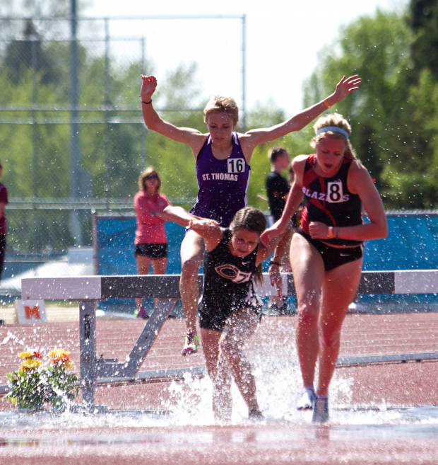 Tommie Megan Gossfeld hurdles in the steeple chase. Gossfeld finished with a time of 12:08:69 on Saturday. (Andrew Brinkmann/TommieMedia) 
