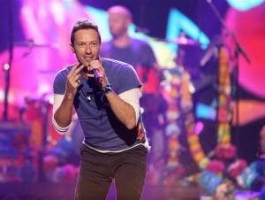 In this Sunday, Nov. 22, 2015 file photo, Chris Martin of Coldplay performs at the American Music Awards at the Microsoft Theater, in Los Angeles. Coldplay will perform at the Pepsi Super Bowl 50 Halftime Show on CBS Sunday, Feb. 7, 2016, the NFL announced on Thursday, Dec. 3, 2015. (Photo by Matt Sayles/Invision/AP, File)