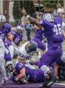 Fullback Jeremy Molina breaks past the Carleton defense for a touchdown in the first half. (Carlee Hackl/TommieMedia)