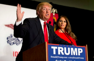 Republican presidential candidate Donald Trump is joined by his wife Melania Trump as he speaks during a campaign event, Monday, Feb. 1, 2016, in Cedar Rapids, Iowa. (AP Photo/Mary Altaffer)