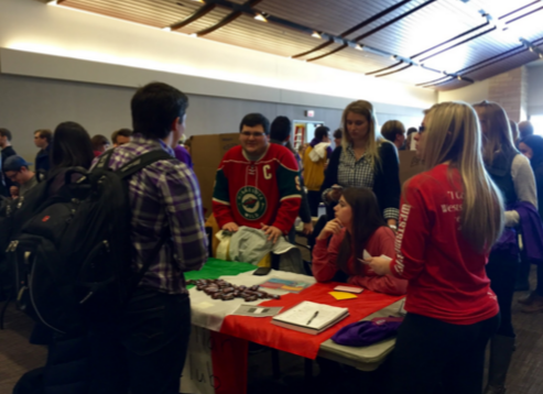 Italian Club members, including President Maya Gardiner and Vice President of Operations Austin Maffie, talk with prospective members at the spring activities fair. Italian professor Danila Cannamela came up with idea for Italian Club. (Emily Sweeney/TommieMedia)