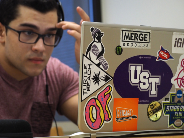 Sophomore Jeremy Molina focuses diligently on pursuing leads for painting jobs. Molina has often used the library as his workspace for calling potential customers and managing his business. (Adam Kraft/TommieMedia)