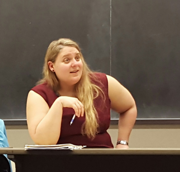 English Professor Lucia Pawlowski talks with students about their nonprofit presentations before class. This is Pawlowski's first semester working with the sustainability initiatives office. (Meghan Meints/TommieMedia)