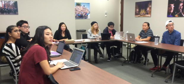 Executive board members of ASIA Club direct their attention to the projection screen in the front of the room. The newly-founded organization’s first meeting took place Tuesday, April 5.  (Sophie Carson/TommieMedia)