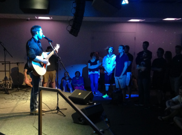 St. Thomas sophomore Jonathon Shields performs his original song “Home” in front of an audience of St. Thomas students, faculty and community members. The release party for Volume II of the UST Sampler was held Tuesday, May 3 in the ASC Lower Level Dance. (Carolyn Meyer/TommieMedia)