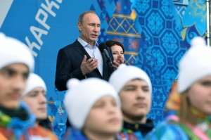 Russian President Vladimir Putin speaks while visiting the Coastal Cluster Olympic Village ahead of the 2014 Winter Olympics on Wednesday, Feb. 5, 2014, in Sochi, Russia.  (AP Photo/Pascal Le Segretain, Pool) 