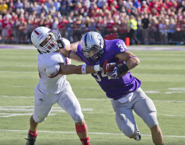 Running back Brenton Braddock stiff arms a Johnnie defender in 2013. This year, ESPN’s “SportsCenter on the Road” will join the pregame festivities. (Jake Remes/TommieMedia) 