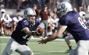 <p>Quarterback Dakota Tracy hands the ball off the running back Ben Wartman. St. Thomas racked up more than 60 points against Hamline last year. (John Kruger/TommieMedia)</p>