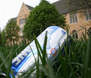 An empty can of beer, a remnant of the previous weekend, litters the lawn in front of the O'Shaughnessy-Frey Library Monday, May 3.  (Shane Kitzman/TommieMedia)