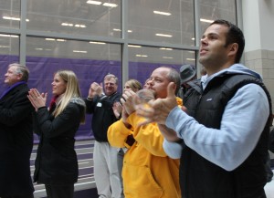 crowd <p>St. Thomas community members cheer as Caruso is named the Liberty Mutual Coach of the year. About 50 people gathered to watch the live announcement in the AARC atrium. (Theresa Malloy/TommieMedia)</p>