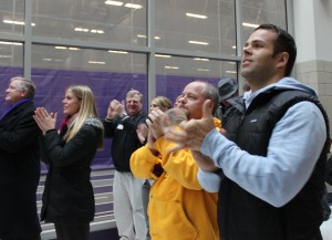 <p>St. Thomas community members cheer as Caruso is named the Liberty Mutual Coach of the year. About 50 people gathered to watch the live announcement in the AARC atrium. (Theresa Malloy/TommieMedia)</p>