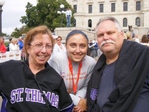 Erin Weber (center) and her father, Mike Weber (right), pose for a photo. Mike was diagnosed with multiple sclerosis when Erin was 3. (Photo courtesy of Erin Weber) 