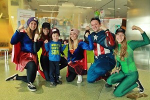 St. Thomas Love Your Melon campus crew members pose wearing superhero costumes while visiting children in the hospital. Six members of the St. Thomas crew will attend a national Love Your Melon conference in March, called the APEX Experience. (Rachel Seifert/Rachabella Photography)  