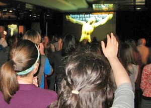 <p>Students join in praise and worship at Shine in Koch fireside. Shine is one of two nondenominational groups on campus available for all students to attend, regardless of their religious beliefs. (Sara Kovach/TommieMedia)</p>
