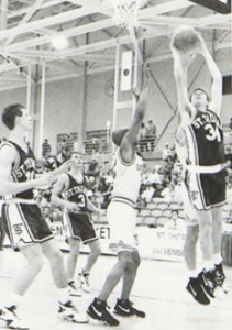 John Tauer, now an assistant men's basketball coach and psychology professor, attempts a layup during a 1993-94 Tommie basketball game.