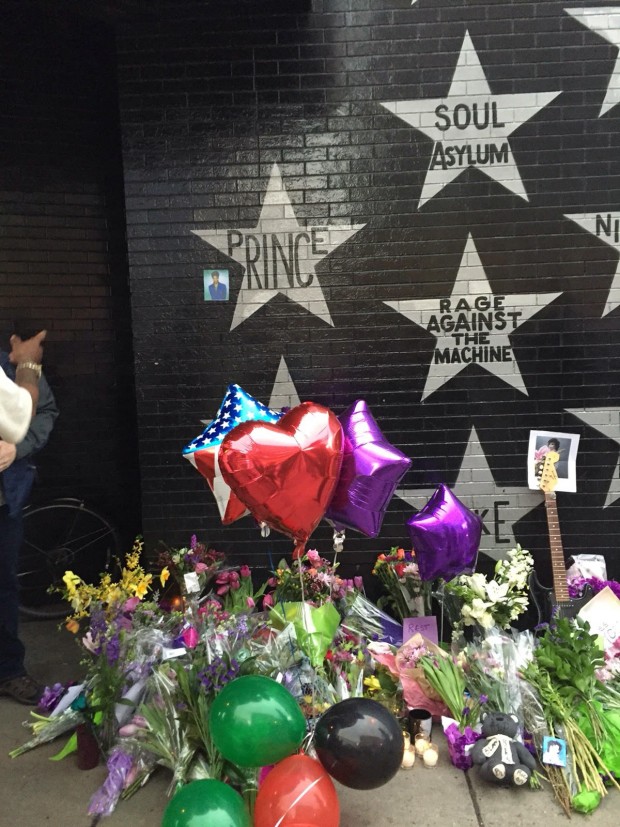 Prince fans paid tribute to the music icon by leaving flowers and balloons at a memorial at First Avenue. The Minnesota performer was found dead in his Chanhassen home Thursday. (Photo credit: Pam Adams)