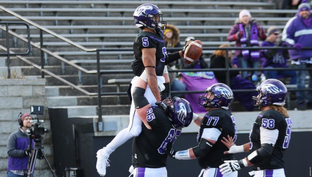Whitewater remains unbeaten: Senior lineackers Austin Jones (65) and Pat Costello (77) celebrate with wide receiver Manny Jones (5) after a touchdown on Saturday against Wittenberg. (www.uwwsports.com)