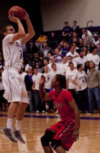 <p>Guard Will DeBerg shoots over his Falcon defender. DeBerg finished with a team-high 12 points Tuesday in the team's home opener. (Ali Stinson/TommieMedia)</p> 