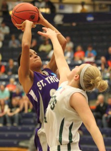 <p>Junior forward Taylor Young shoots over an Illinois-Wesleyan defender in the national semifinal game last season in Holland, Mich. Young received preseason All-America honors last week (Ryan Shaver/TommieMedia)</p>