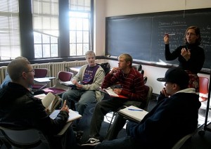 <p>English professor Heather Bouwman discusses writing techniques with students in her English 111 course. After next summer, this course will be replaced with a new course, English 121. (Maggie Clemensen/TommieMedia)</p> 